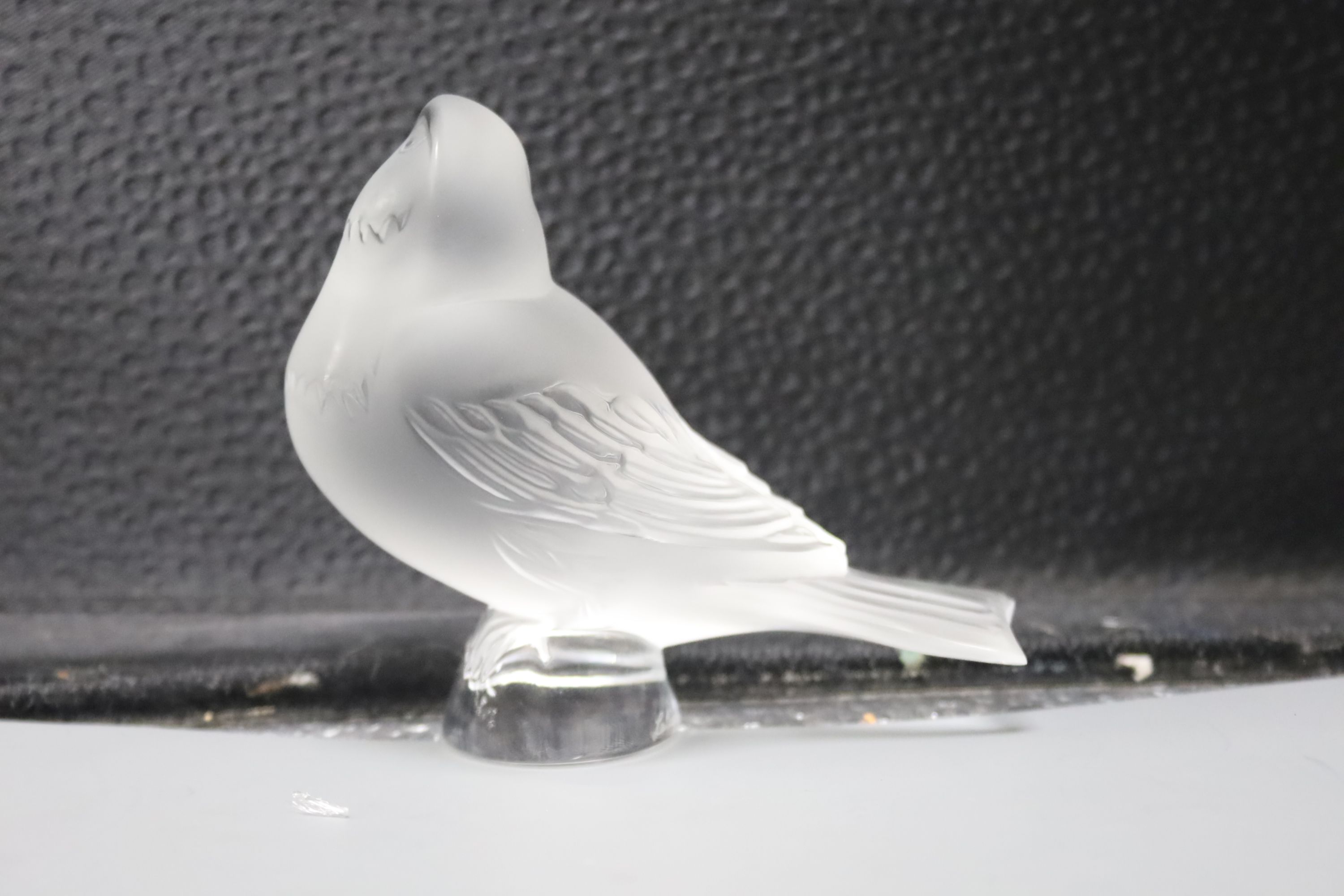 A Lalique 'Nogent' bowl and two frosted glass models of birds, 'Singing Robin' and 'Worried Robin'